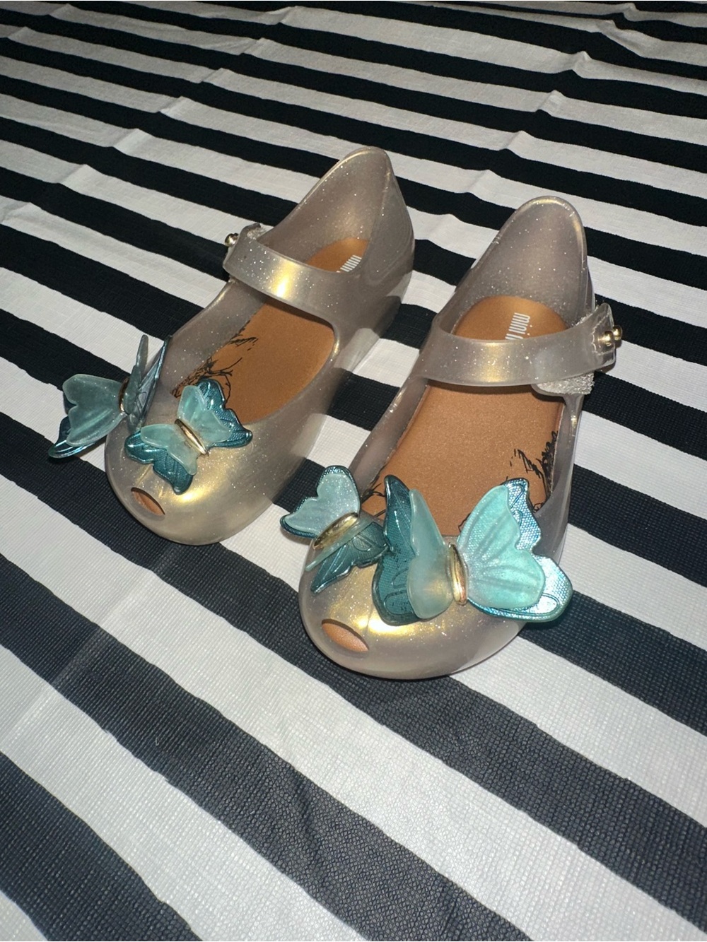 Mini Melissa Glittery Cream Jelly Mary Janes with Teal Butterfly Accents